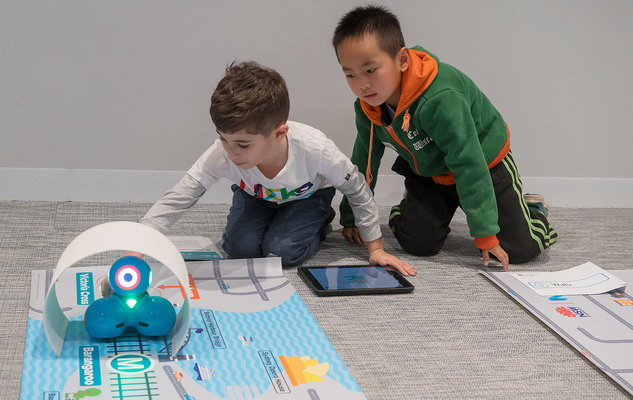 Two students participating in the Sydney Metro Robotics workshop.