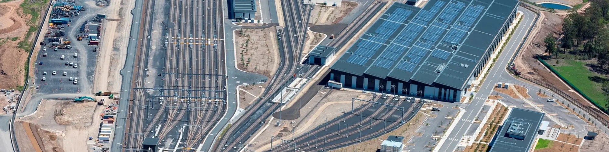 A bird's eye view of Sydney Metro Trains Facility (SMTF) in Rouse Hill located west of Tallawong Station, at the corner of Tallawong Road and Schofields Road.