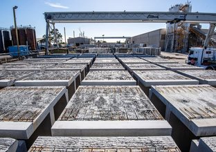 Rows of precast concrete segments are lined up sitting at the western precast facility.