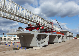 Skytrain concrete segments are laid underneath a bridge on the construction site for the new skytrain.