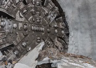 An on the ground view showing Tunnel Boring Machine (TBM) 3 Florence final break through the stone at Sydney Metro's Cherrybrook Station. 