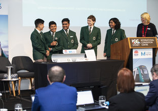 Students from Cumberland High School on stage with Anne Purcell as part of the 2018 Sydney Metro  Minds STEAM Challenge competition.