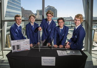 Students from Northern Beaches Secondary College stand with their submission into the 2018 Sydney Metro  Minds STEAM Challenge competition.