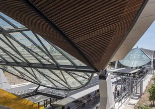 A view of Bella Vista Station platform from above looking through the glass ceilings.