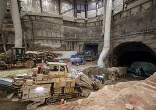 An above the ground view looking down at the construction site with five excavators working on the tunnels at Sydney Metro's Victoria Cross site. 