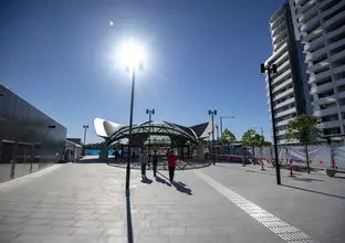 A wide angle view of the outside of Castle Hill Station on a sunny day.