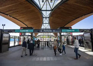 People are walking through the Opal turnstyles into Castle Hill Station on a Metro community day.