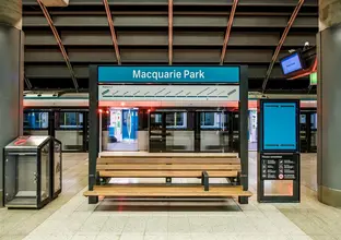 An artist's impression from the platform looking at the platform benches at Sydney Metro's Macquarie Park Station.