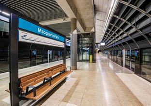 An artist's impression from the platform behind the screen safety doors showing the platform benches at Sydney Metro's Macquarie Park Station.