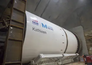 On the ground view looking up at part of the tunnel boring machine Kathleen as viewed from inside the station box. 