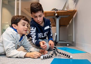 Image of two students participating in the stop motion animation workshop as part of Sydney Metro's Education Program. 