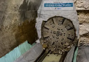 The cutterhead on tunnel boring machine Wendy can be seen breaking through the wall at Victoria Cross Station