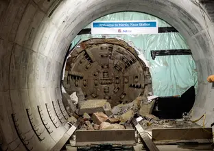 The cutterhead of tunnel boring machine Nancy can be seen breaking through the wall at Martin Place Station. 