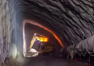 A digger machine is working inside the Barangaroo crossover cavern construction site.