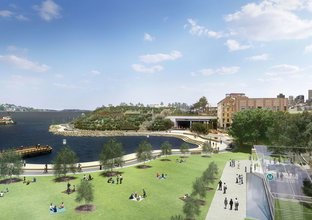 An artist's impression of a bird's eye view of Sydney Metro Barangaroo Station entrance, looking north. The station entrance is on the right, and a green space and Sydney Harbour are on the left in the image.