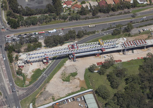 A bird's eye view showing the metal structure of the Gantry crane at Sydney Metro's Kellyville Station. 