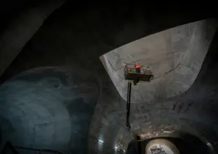 Construction worker in high viz on the top of a crane in the Martin Street Cavern