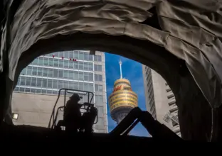 An on the ground view looking up at construction of the elevator shaft at Sydney Metro's Martin Place Station. 