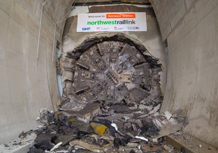 An on the ground view showing Tunnel Boring Machine (TBM) 1 Elizabeth final break through the stone at Sydney Metro's Hills Norwest Station as part of the North West Rail Link project. 