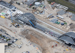 An ariel shot of the Bella Vista Station construction site. The newly installed blue gum leaf shaped canopies can be seen from above.