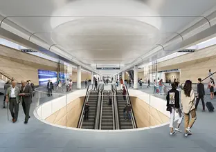 Artist's impression of commuters walking around inside the new Sydney Metro Central Station entrance at the top of the escalators.