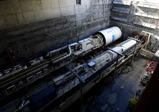 An arial view looking down at Tunnel Boring Machine Mabel in place at a Sydney Metro construction site.