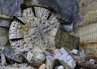 An on the ground view showing Tunnel Boring Machine (TBM) 2 Florence final break through the stone at Sydney Metro's Hills Showground Station. 