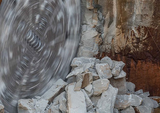 An on the ground view showing Tunnel Boring Machine (TBM) Maria spinning as it is breaking through the stone at Sydney Metro's Epping Station. 