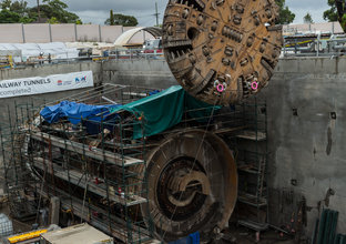 The cutterhead from tunnel Boring Machine (TBM) 2 Florence is being removed by a crane at Cherrybrook Station construction site. 