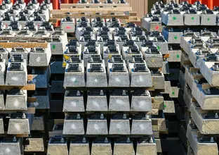 Close up view of stacks of pre-cast concreate are lined up in front of several shipping containers at Sydney Metro Trains Facility South Yard.