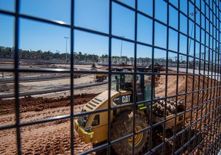 A view from the other side of the fencing at the construction site of the Sydney International Speedway.