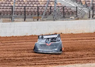 A race car drives in the dirt track at the new Eastern Creek Speedway.