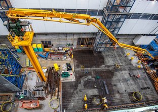 A birds eye view of several construction workers getting ready for the concrete pour at Victoria Cross South site.