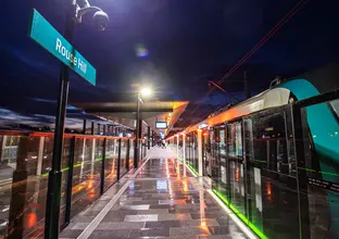 Sydney Metro train at the platform at Sydney Metro's Rouse Hill Station at night. 