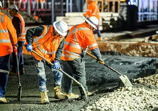 Construction workers laying concrete at Sydney Metro's Chatswood Station