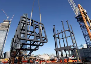 Steel structures are craned into position at Sydney Metro's new station, Barangaroo.