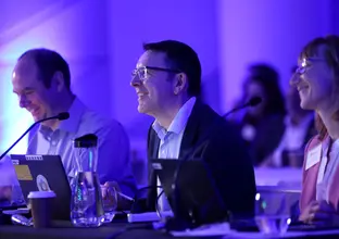 A close up shot of the 3 smiling members of the Sydney Metro Judging panel.