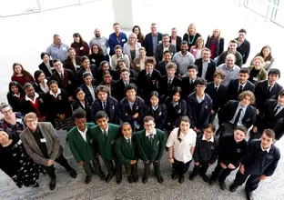 An aerial view group photo of Sydney Metro staff, teachers and students involved in the competition.