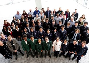 An aerial view group photo of Sydney Metro staff, teachers and students involved in the competition.