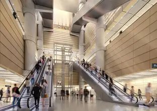 Customers using two escalators inside building atrium