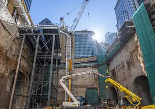 Crane and heavy machinery at construction site