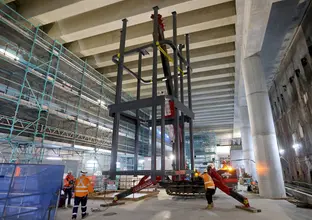 Steel structure craned into position down into the station box on Sydney Metro's new station at Barangaroo.