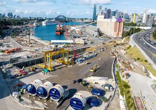 Aerial shot of cutterhead component of a tunnel boring machine (TBM) arrival at White Bay, Sydney.