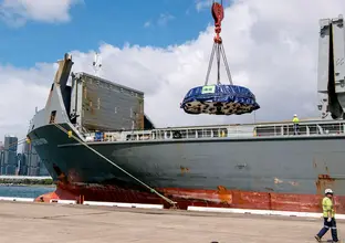 Cargo shit unloading cutterhead component from a tunnel boring machine (TBM) onto dock