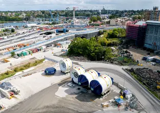 Aerial shot of four tunnel boring machine cutterheads at The Bays construction site