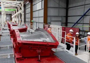 A row of red tunnel segments at the Sydney Metro Eastern Creek facility.