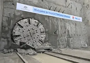 TBM Eileen crushed through a wall of rock to arrive at the Airport Terminal metro station site