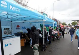 A metro model is displayed in a Sydney Metro stall