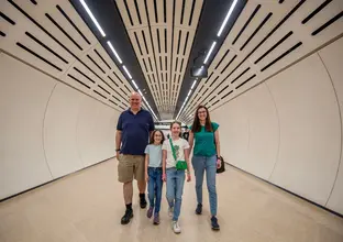 Family walking through the station