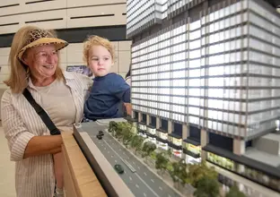 Lady and child looking at the station model